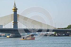 Suspension bridge towering over the water in Bangkok with beautiful views