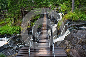 Suspension cable bridge crossing the river