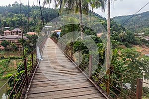 Suspension foot bridge in Muang Khua town, La