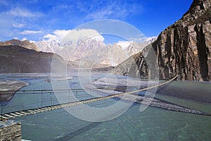 Suspension Hussaini bridge in Passu, Upper Hunza. Karakoram mountains and Hunza river