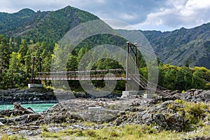 Suspension pedestrian bridge over the Katun river near the village of Elanda