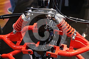 Suspension used on a small electric powered buggy. View of springs used to absorb shocks from a vehicle when its moving