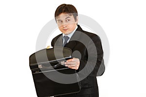 Suspicious businessman holding open briefcase