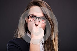 Suspicious businesswoman doing watching you gesture