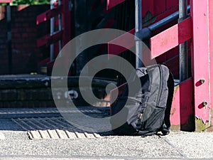 Suspicious rucksack left on railway platform medium shot