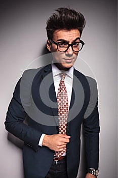 Suspicious young business man wearing glasses