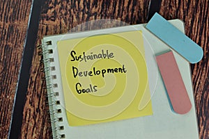 Sustainable Development Goals write on a book isolated on office desk