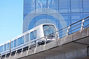 Sustainable driverless modern light rail metro train on railroad track in Europe