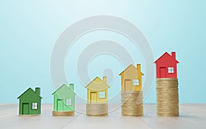 Sustainable Energy Efficiency in Real Estate: Color houses on coin stacks