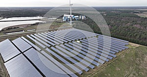 Sustainable energy generated using solar panels, particularly in an industrial zone for energy supply. Birds eye aerial