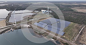 Sustainable energy generated using solar panels, particularly in an industrial zone for energy supply. Birds eye aerial