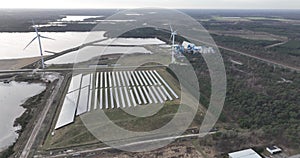 Sustainable energy generated using solar panels, particularly in an industrial zone for energy supply. Birds eye aerial