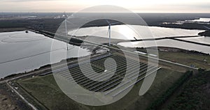 Sustainable energy generated using solar panels, particularly in an industrial zone for energy supply. Birds eye aerial