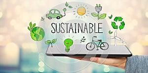 Sustainable with man holding a tablet