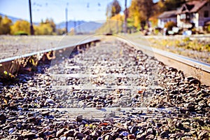 Sustainable traveling by train: Rail track and colorful, idyllic landscape in fall