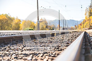 Sustainable traveling by train: Rail track and colorful, idyllic landscape in fall