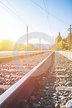 Sustainable traveling by train: Rail track and colorful, idyllic landscape in fall