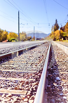 Sustainable traveling by train: Rail track and colorful, idyllic landscape in fall