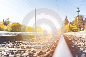 Sustainable traveling by train: Rail track and colorful, idyllic landscape in fall