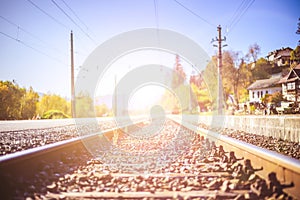 Sustainable traveling by train: Rail track and colorful, idyllic landscape in fall