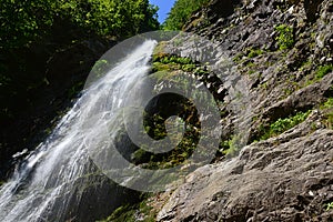 Sutov waterfall, right side view. One of the tallest waterfalls in Slovakia, during summer season.