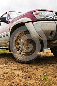 SUV automobile tire with wet clay