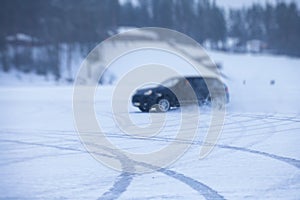 SUV car drifting in snow, during competition, sport car racing drift on snowy race track in winter