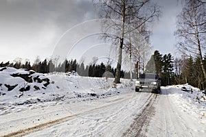 Suv, car, driving through snowy landscape