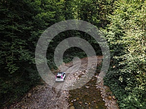 suv car at off road. canyon in carpathian mountains