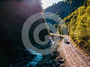 suv car at off road. canyon in carpathian mountains