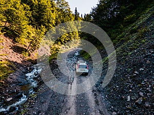 suv car at off road. canyon in carpathian mountains