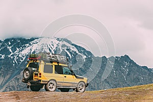 SUV Car On Off Road In Spring Mountains Landscape In Georgia. Drive