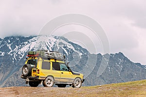 SUV Car On Off Road In Spring Mountains Landscape In Georgia. Drive