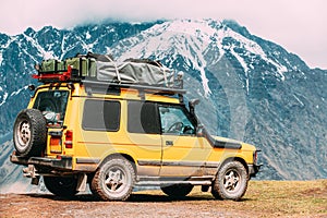 SUV Car On Off Road In Spring Mountains Landscape In Georgia. Drive And Travel Concept. Landscape Of Gorge At Spring