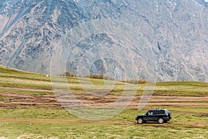 SUV Car On Off Road In Spring Mountains Landscape In Georgia. Landscape