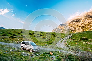 SUV Car On Off Road In Summer Mountains Landscape. Active Lifestyle