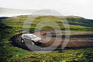 SUV car. Travel concept with big 4x4 sport and modern car in mountains. Iceland. photo