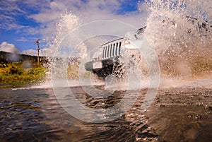 Suv in crossing river