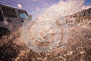 Suv in crossing river