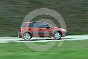 Suv driving on country road photo