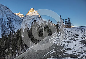 Suv is staying over the hill under the dawn light, Elbrus, Russia