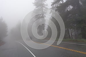 SUV traveling on Foggy Mountain Road