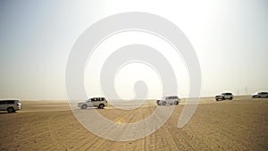 SUV Trip for tourists in the desert. Stock. Group of people driving off road car in the Vietnam desert during a safari