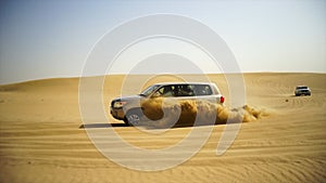 SUV Trip for tourists in the desert. Stock. Group of people driving off road car in the Vietnam desert during a safari
