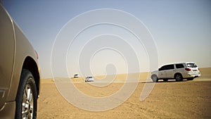 SUV Trip for tourists in the desert. Stock. Group of people driving off road car in the Vietnam desert during a safari