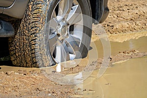 Suv 4wd car rides through muddy road