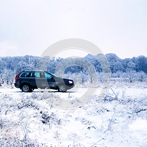 SUV in winter countryside photo