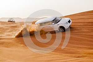 SUVs Trek Across the Desert Dunes