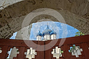 Suzdal Kremlin: view through old wooden gates to the Cathedral of Nativity. Suzdal, Russia