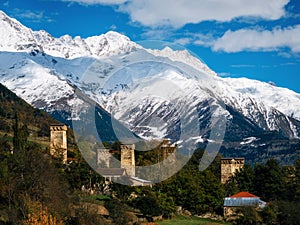 Svan towers in Mestia against mountains, Svaneti, Georgia